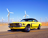 MST 01 RK0738 02
1970 Ford Mustang Yellow And Black Low 3/4 Front View On Road By Wind Farm