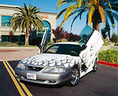 MST 01 RK0773 01
1997 Ford Mustang GT White Silver Flames 3/4 Front View On Pavement By Palm Trees