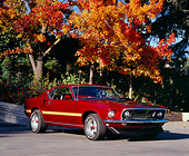 MST 01 RK0793 05
1969 Ford Mustang Mach 1 Red Yellow Stripe 3/4 Side View On Pavement By Fall Trees