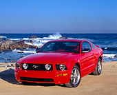MST 01 RK0802 04
2005 Ford Mustang GT Coupe Red 3/4 Front View On Pavement By Ocean