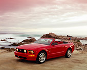 MST 01 RK0832 04
2005 Ford Mustang GT Convertible Red 3/4 Front View On Sand By Ocean
