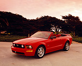 MST 01 RK0833 05
2005 Ford Mustang GT Convertible Red 3/4 Front View On Pavement Trees Background Filtered