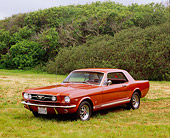 MST 01 RK0874 03
1966 Ford Mustang GT Emberglo 3/4 Front View On Grass Bushes Background