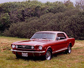 MST 01 RK0875 01
1966 Ford Mustang GT Emberglow 3/4 Front View On Grass Bushes Background