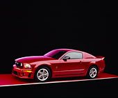 MST 01 RK0888 10
2005 Ford Roush Mustang Red Side 3/4 View On Red Floor Purple Lighting Studio