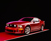 MST 01 RK0889 08
2005 Ford Roush Mustang Red Front 3/4 View On Red Floor Purple Lighting Studio