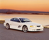 MST 02 RK0017 02
1994 Ford Saleen Mustang S351 White 3/4 Side View On Pavement By Water At Dusk