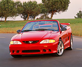 MST 02 RK0027 02
1995 Ford Saleen Mustang S351 Convertible Red 3/4 Front View On Pavement By Grass And Trees