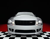 MST 02 RK0057 07
2005 Ford Saleen Mustang Supercharged Silver Wide Angle Head On Shot On Checkered Floor Studio