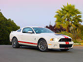 MST 03 RK0894 01
2011 Shelby Ford Mustang GT500 White With Red Stripe 3/4 Front View On Pavement By Trees