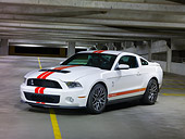 MST 03 RK0895 01
2011 Shelby Ford Mustang GT500 White With Red Stripe 3/4 Front View In Parking Garage At Night