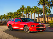MST 03 RK0903 01
2011 Shelby Ford Mustang GT500 SVT Red With White Stripes 3/4 Front View On Pavement By Palm Trees