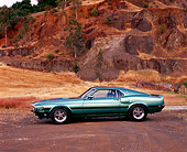 MST 03 RK0074 02
1969 Ford Mustang Shelby Cobra GT350 Green Profile On Dirt Against Rocks