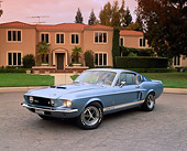 MST 03 RK0126 03
1967 Shelby Mustang GT500 Blue 3/4 Front View On Pavement By House