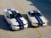 MST 03 RK0153 01
2007 GT500 And 1966 GT350 Ford Shelby White Blue Stripe Overhead 3/4 Front On Pavement