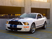 MST 03 RK0169 01
2007 Ford Shelby GT500 White Blue Stripe 3/4 Front View On Pavement