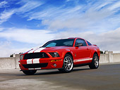 MST 03 RK0173 01
2007 Ford Shelby GT500 Red And White Low 3/4 Front View On Pavement Blue Sky
