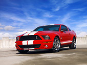 MST 03 RK0175 01
2007 Ford Shelby GT500 Red And White Low 3/4 Front View On Pavement Blue Sky