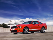 MST 03 RK0176 01
2007 Ford Shelby GT500 Red And White Low 3/4 Side View On Pavement Blue Sky