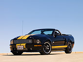 MST 03 RK0184 01
2007 Ford Shelby GT-H Convertible Black And Gold Low 3/4 Front View On Pavement
