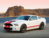 MST 04 RK0049 01
2013 Ford Mustang GT500 White With Red Stripes 3/4 Front View On Pavement By Water