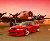 MST 04 RK0030 01
2000 Ford Mustang Cobra R Red 3/4 Front View On Pavement By Plane Red Sky