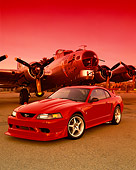 MST 04 RK0030 11
2000 Ford Mustang Cobra R Red 3/4 Front View On Pavement By Plane Red Sky