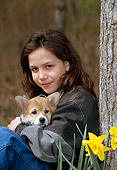 PEO 02 CE0001 01
Girl Holding Pembroke Welsh Corgi Puppy By Tree And Flowers