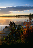 PEO 02 DB0002 01
Fisherman And Labrador Retriever Sitting On Dock Watching Sunset At Lake