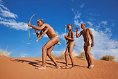 PEO 08 MH0003 01
San Hunter Adults Passing Down Hunting Techniques To Boy Namibia