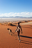PEO 08 MH0008 01
San Hunter Walking With Traditional Bow And Arrow And Cheetah Namibia