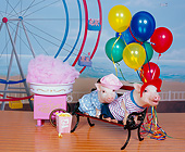 PIG 01 RK0237 01
Boar-dwalk Two Little Pigs On Bench By Cotton Candy Machine And Ferris Wheel