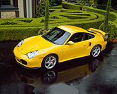 POR 01 RK0019 04
2001 Porsche 996 Twin Turbo Yellow Overhead 3/4 Side View On Pavement