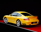 POR 01 RK0026 03
2001 Porsche 996 Twin Turbo Yellow 3/4 Rear View On Red Floor Gray Line Studio