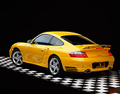 POR 01 RK0030 01
2001 Porsche 996 Twin Turbo Yellow 3/4 Rear View On Checkered Floor Studio