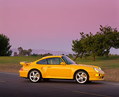 POR 02 RK0014 02
1997 Porsche Turbo S Yellow Front 3/4 View On Grass And Trees Filtered