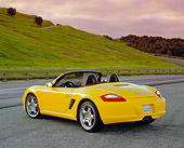 POR 04 RK0589 01
2004 Porsche Boxster S Convertible Yellow 3/4 Rear View On Pavement By Grass Hills Filtered