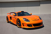 POR 04 RK0834 01
2008 Porsche Gemballa Mirage GT Orange 3/4 Front View On Pavement
