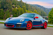 POR 04 RK0916 01
2011 Porsche GT3 RS Blue And Red 3/4 Front View On Pavement By Evergreen Trees