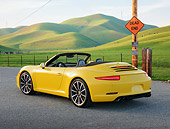 POR 04 RK0944 01
2013 Porsche 911 Carrera S Cabriolet Yellow 3/4 Rear View On Pavement By Grassy Hills