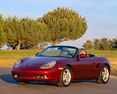 POR 04 RK0095 05
1997 Porsche Boxster Convertible Burgundy 3/4 Front View On Pavement By Trees