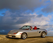 POR 04 RK0194 05
1998 Porsche Boxster Convertible Silver 3/4 Side View On Pavement Gray Clouds Blue Sky