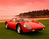 POR 04 RK0392 13
1964 Porsche GTS 904 Red Front 3/4 View On Grass By Water Filtered