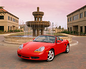 POR 04 RK0424 02
2000 Porsche Boxster S Convertible Red 3/4 Front View By Water Fountain