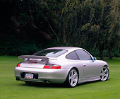 POR 04 RK0444 02
2001 Porsche Ruf 996 Silver Rear 3/4 View On Grass Trees Background