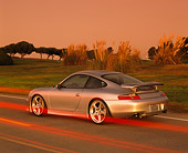 POR 04 RK0450 01
2001 Porsche RUF RGT Silver Rear 3/4 View With Special Effects On Pavement