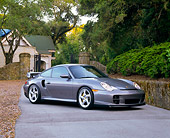 POR 04 RK0465 02
2002 Porsche GT2 Gray 3/4 Side View On Driveway By House And Trees