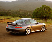 POR 04 RK0472 01
2002 Porsche GT2 Gray 3/4 Rear View On Pavement By Trees