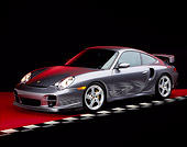 POR 04 RK0477 08
2002 Porsche GT2 Gray 3/4 Side On Red Floor Checkered Line Studio