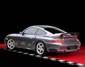 POR 04 RK0480 05
2002 Porsche GT2 Gray 3/4 Rear View On Red Floor Checkered Line Studio